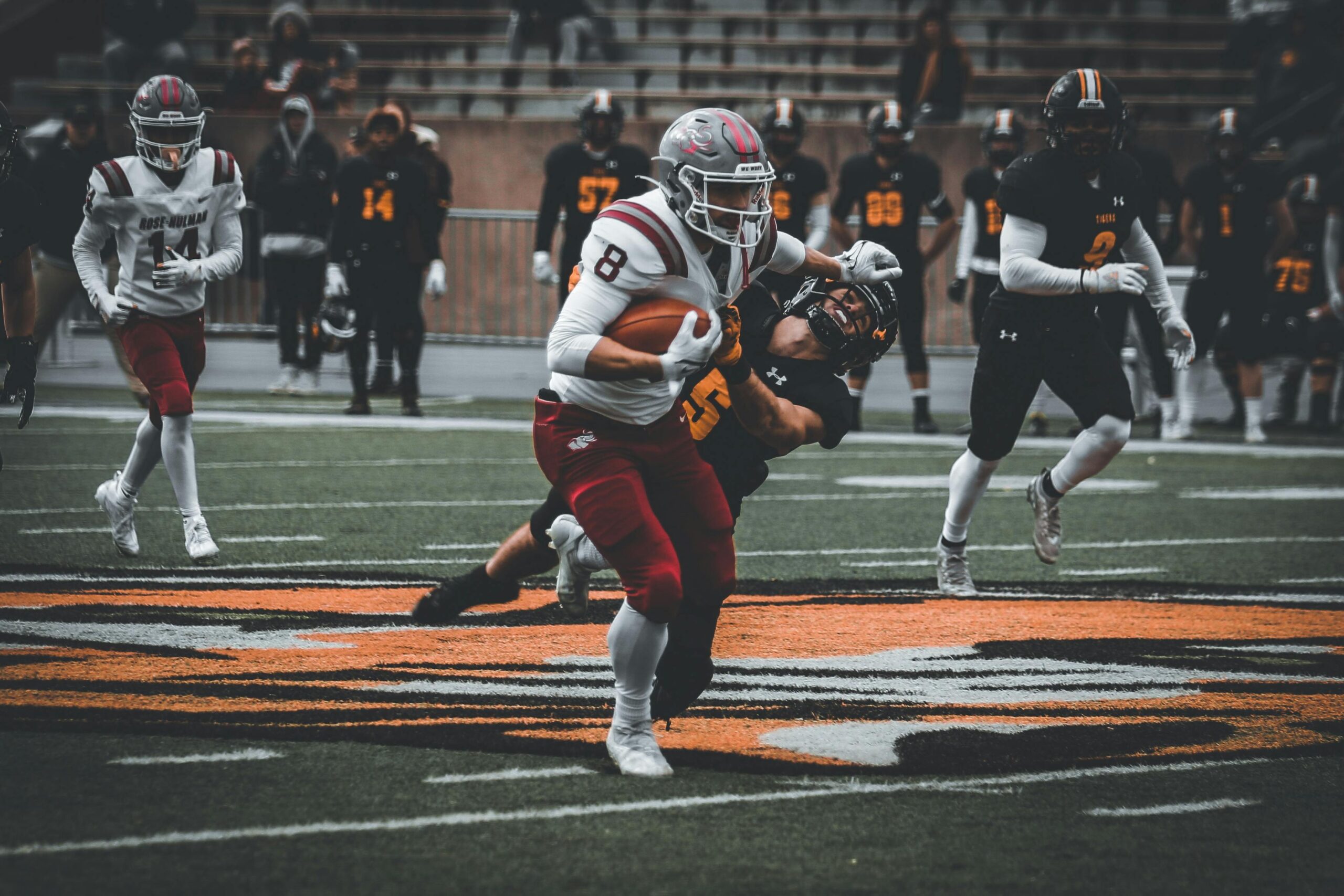 Intense high school football game showcasing action and teamwork on the field.