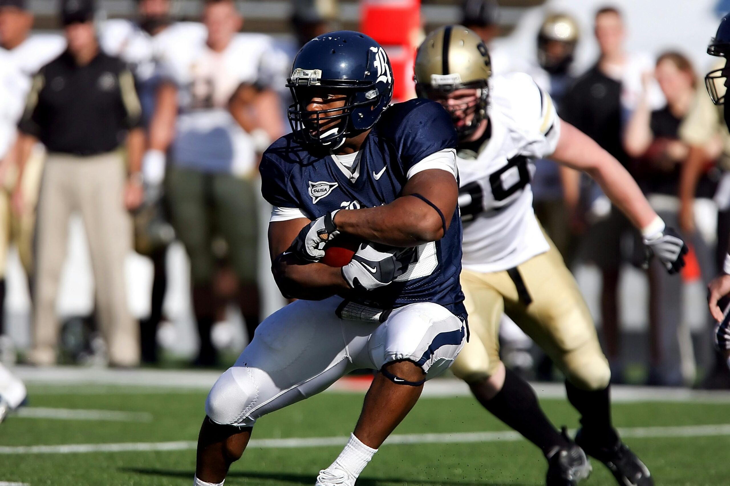 Intense moment captured during an American football game showcasing players in full action on the field.